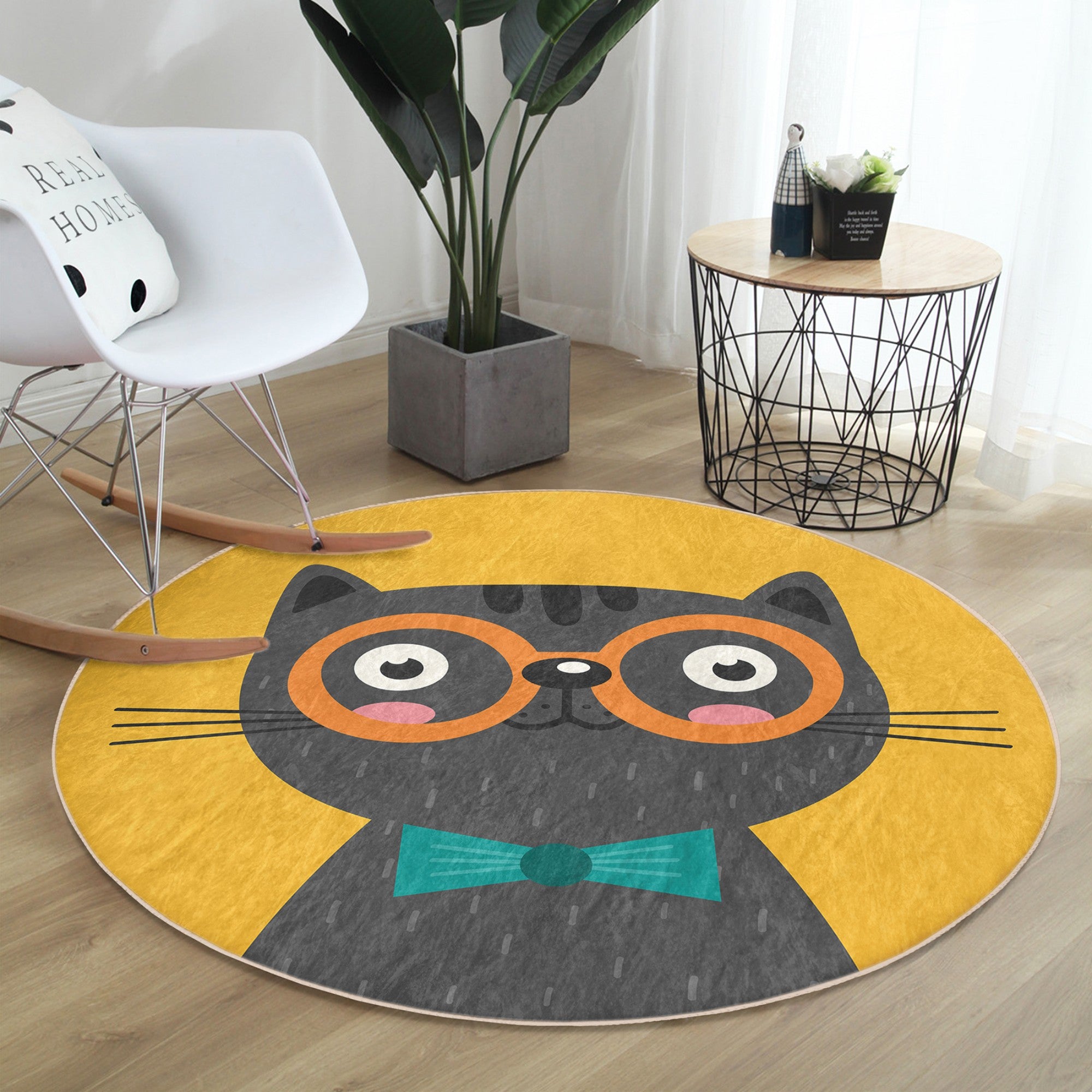 A vibrant yellow round rug featuring a whimsical cat print, perfect for adding charm to any room decor.