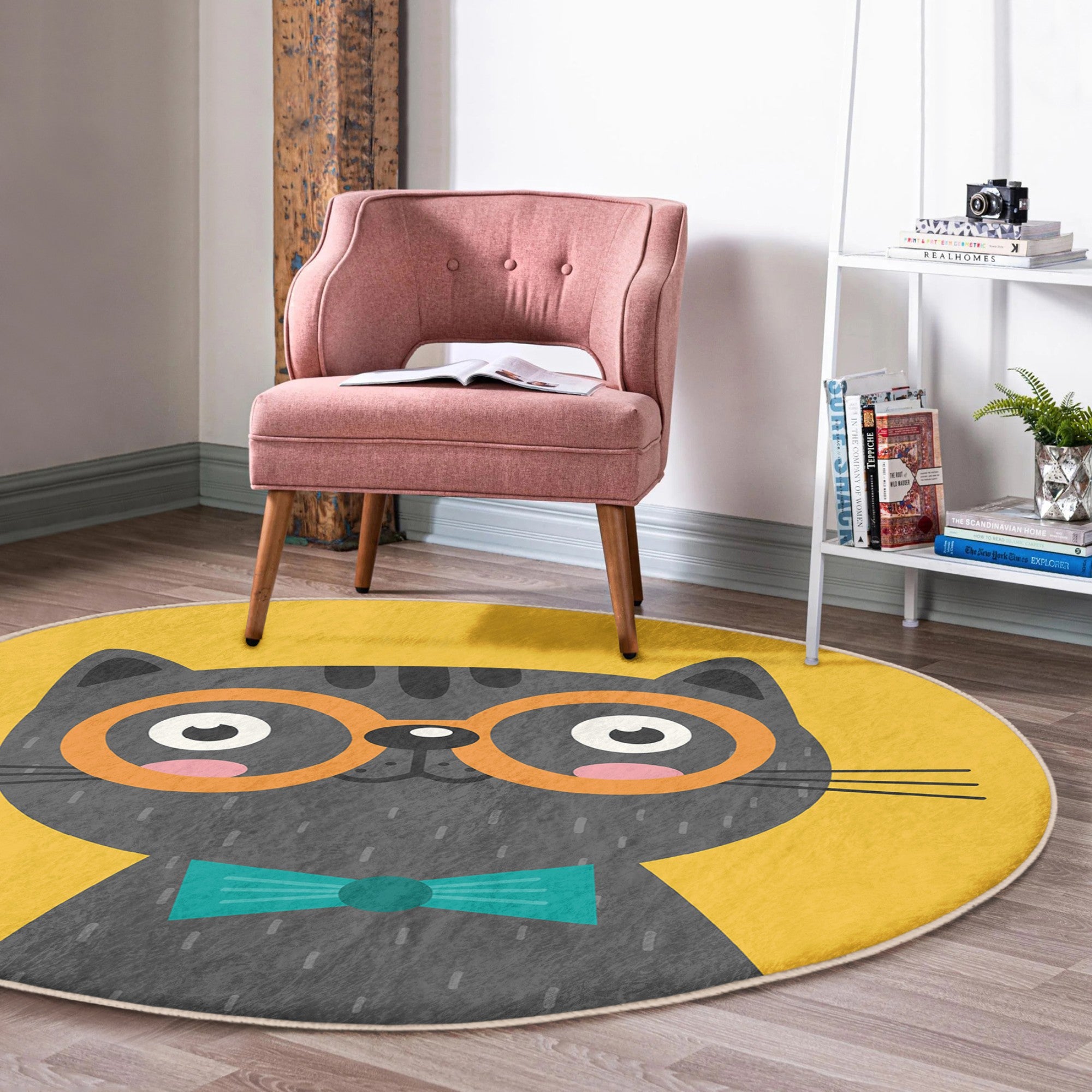 A vibrant yellow round rug featuring a whimsical cat print, perfect for adding charm to any room decor.