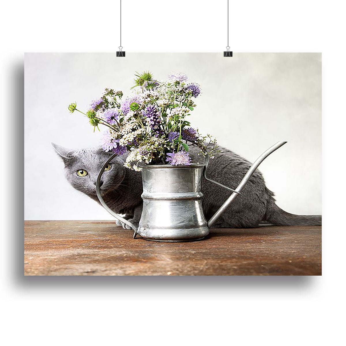 A vibrant canvas print featuring a cat surrounded by colorful flowers, perfect for home decor.