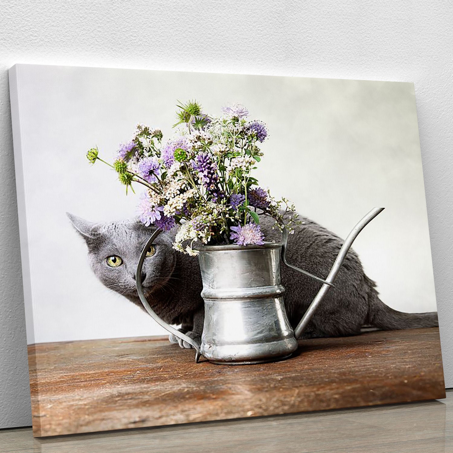 Canvas print featuring a cat surrounded by colorful flowers in an old decorative watering can, showcasing vibrant colors and intricate details.