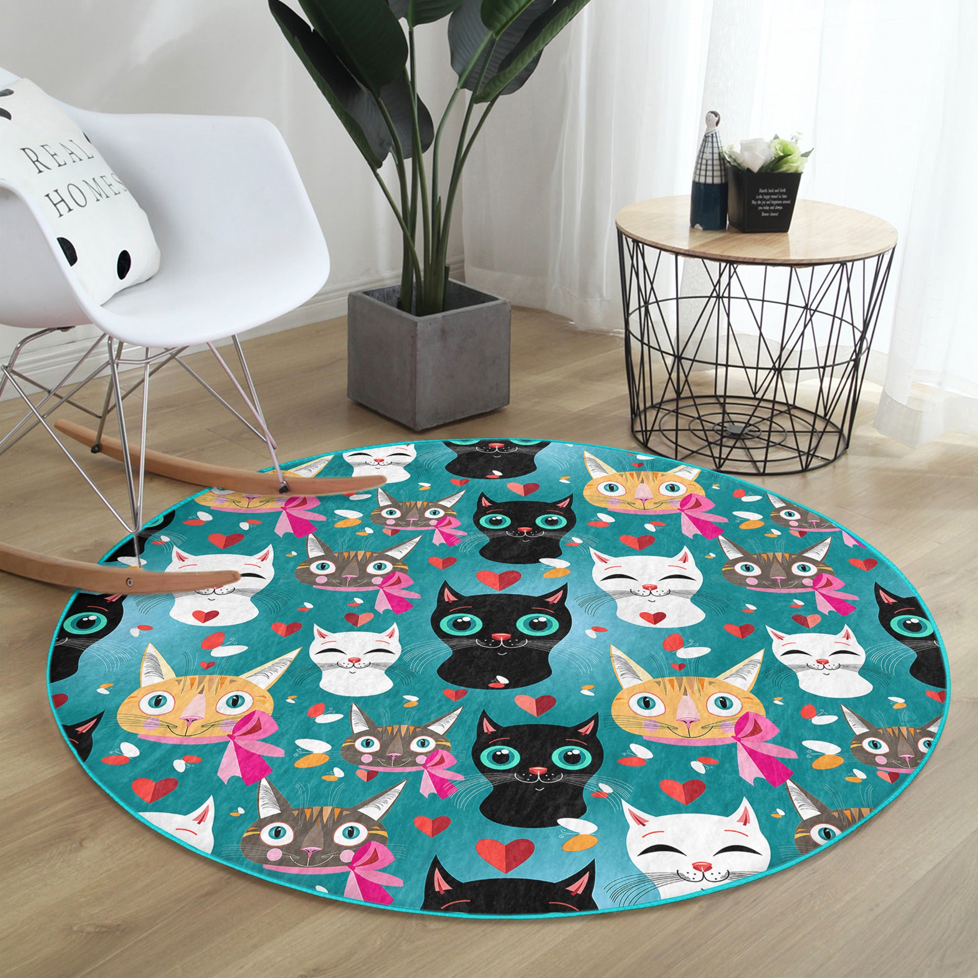 A colorful round rug featuring a playful cat pattern, perfect for children's rooms and cat lovers.