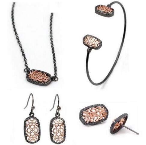 Kendra Style Small Oval Hollow Out Alloy Frame Earrings, featuring a delicate hollow out design perfect for Christmas gifting.