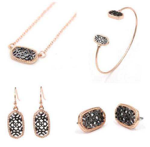 Kendra Style Small Oval Hollow Out Alloy Frame Earrings, featuring a delicate hollow out design perfect for Christmas gifting.