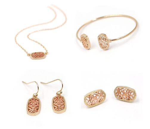 Kendra Style Small Oval Hollow Out Alloy Frame Earrings, featuring a delicate hollow out design perfect for Christmas gifting.