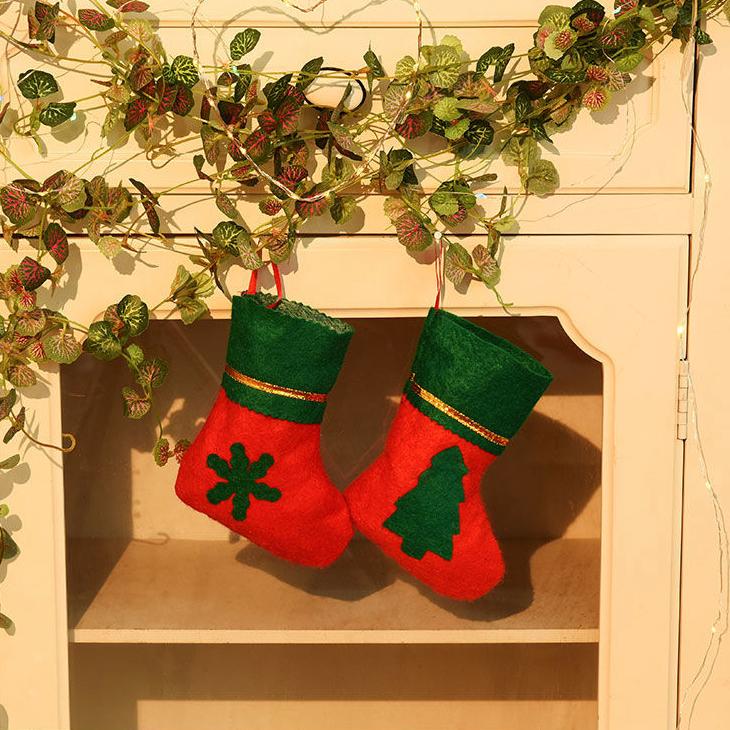 A festive Christmas socks gift bag featuring Santa Claus and snowman designs, perfect for holiday decorations and gift-giving.