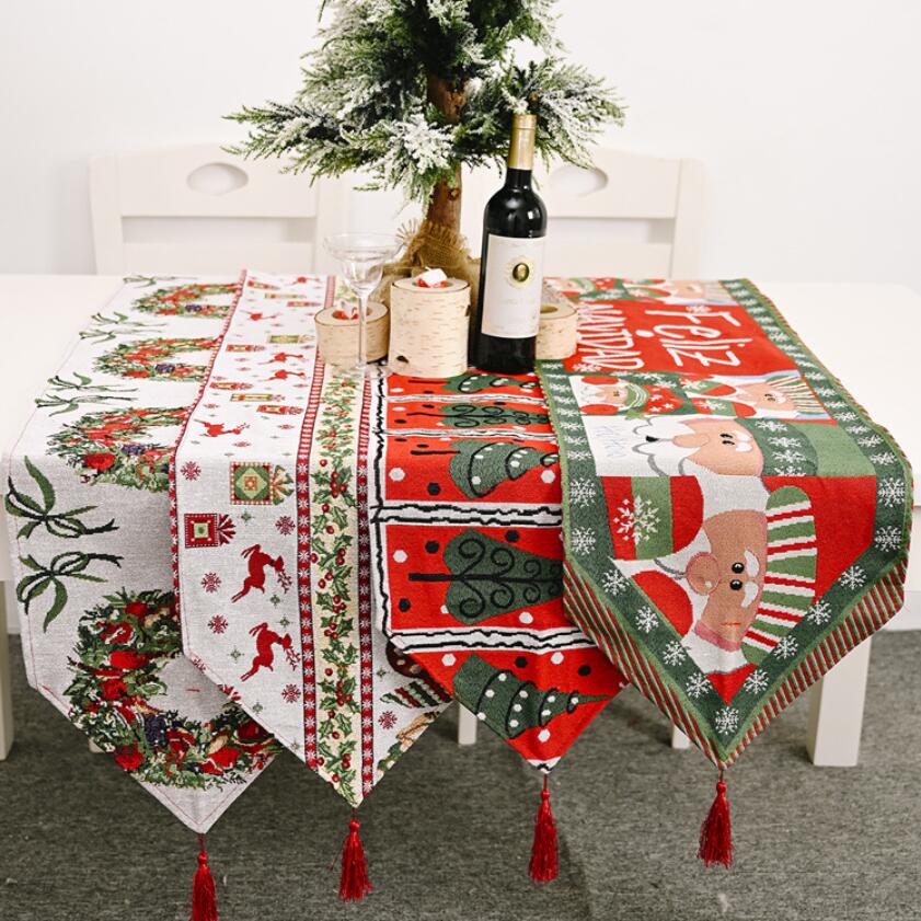 A beautifully knitted Christmas table runner in festive colors, perfect for holiday decorations.