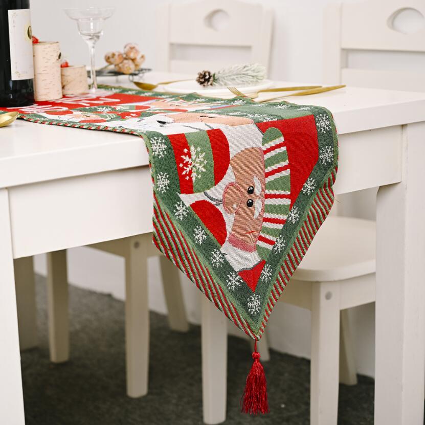 A beautifully knitted Christmas table runner in festive colors, perfect for holiday decorations.