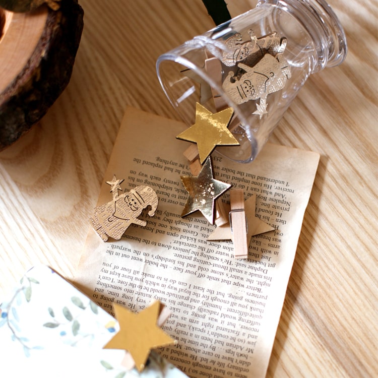 A set of 18 Christmas wood clips in various colors including gold and silver, perfect for holiday decorations and crafts.