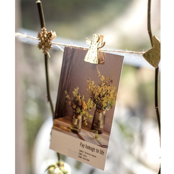 A set of 18 Christmas wood clips in various colors including gold and silver, perfect for holiday decorations and crafts.