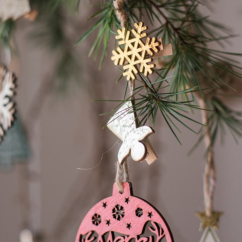 A set of 18 Christmas wood clips in various colors including gold and silver, perfect for holiday decorations and crafts.