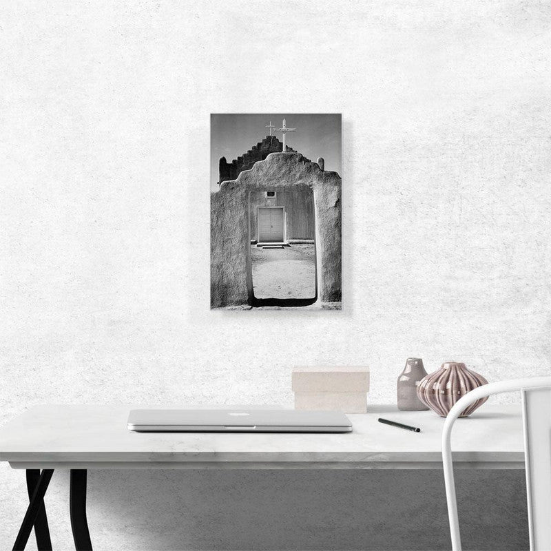 A beautiful canvas print of Taos Pueblo, showcasing its unique adobe architecture and stunning New Mexico landscape.