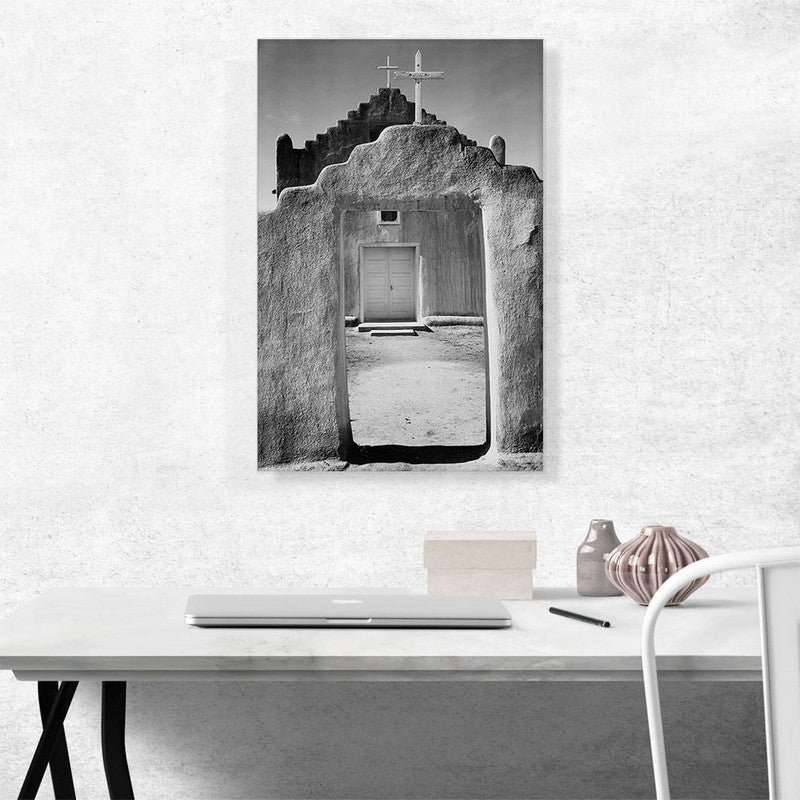 A beautiful canvas print of Taos Pueblo, showcasing its unique adobe architecture and stunning New Mexico landscape.