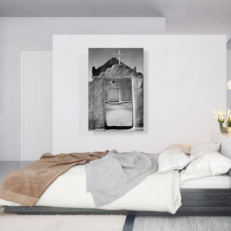 A beautiful canvas print of Taos Pueblo, showcasing its unique adobe architecture and stunning New Mexico landscape.