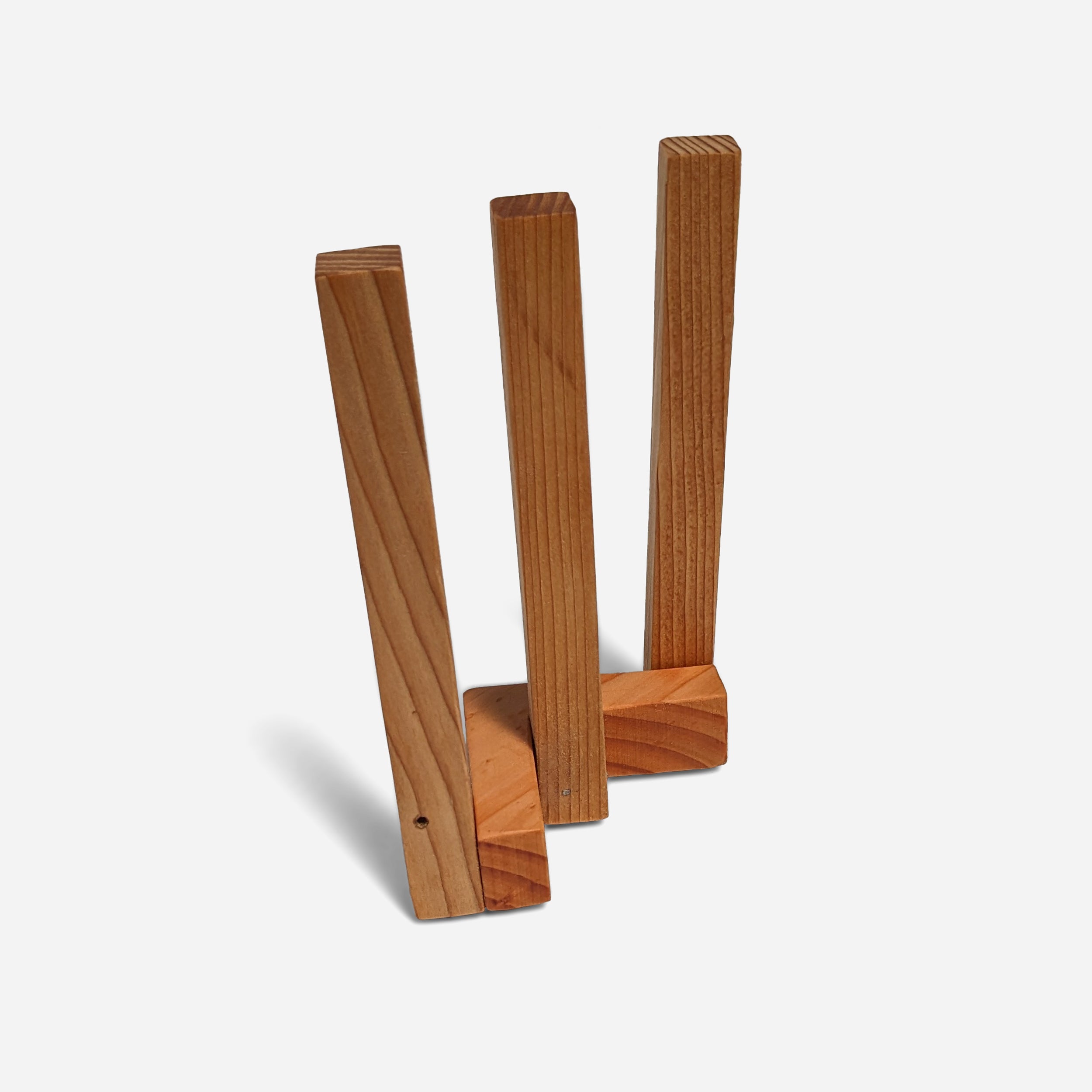 A stylish Clean napkin holder made from Doug Fir, featuring a butcher block oil finish, standing upright with napkins elegantly displayed.