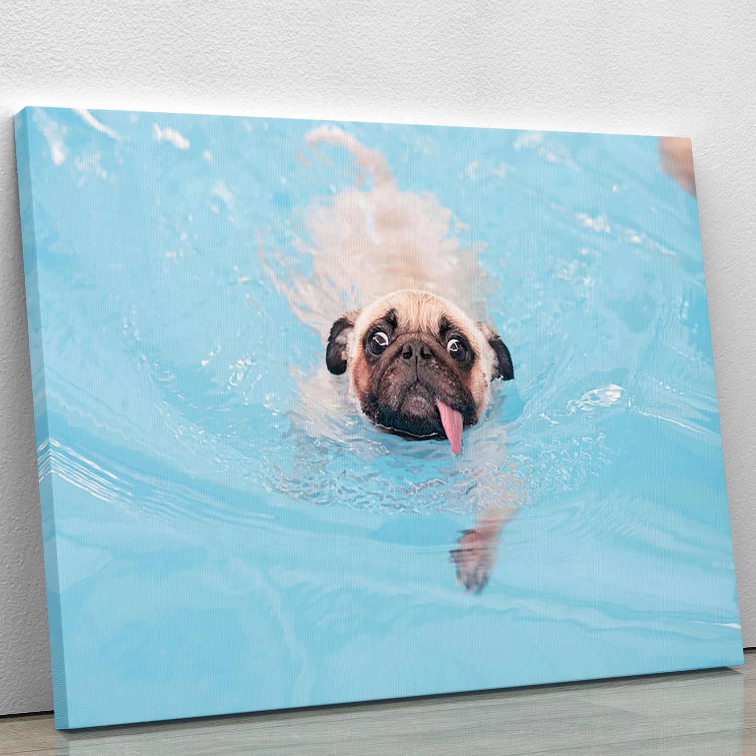 Close-up of a cute Pug puppy on a canvas print, showcasing its adorable features and playful expression.