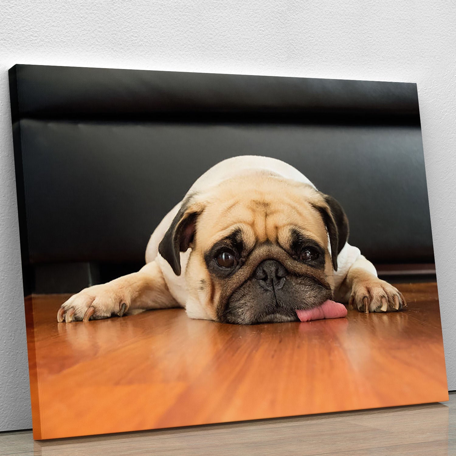 Close-up face of a cute pug on a canvas print, showcasing its expressive eyes and wrinkled face.
