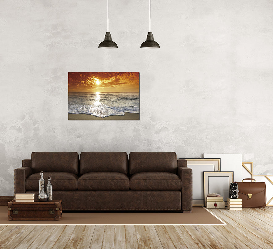 Framed acrylic wall art featuring a vibrant coastal sunset over the beach, showcasing rich colors and a high-gloss finish.