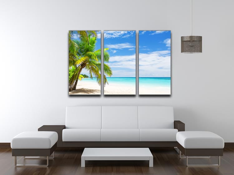 A beautiful 3-panel canvas print featuring coconut palm trees on a white sandy beach, perfect for home decor.
