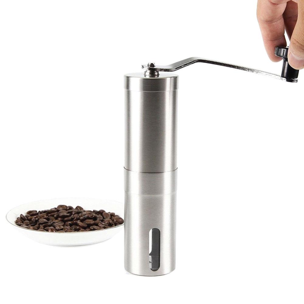 Manual coffee grinder made of stainless steel with ceramic burr, featuring a long crank handle and visible capacity for grinding coffee beans.