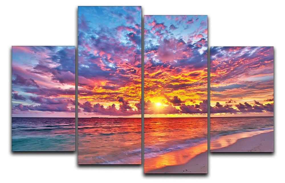 A vibrant 4-panel canvas artwork depicting a colorful sunset over the ocean in the Maldives, showcasing rich hues and serene waters.
