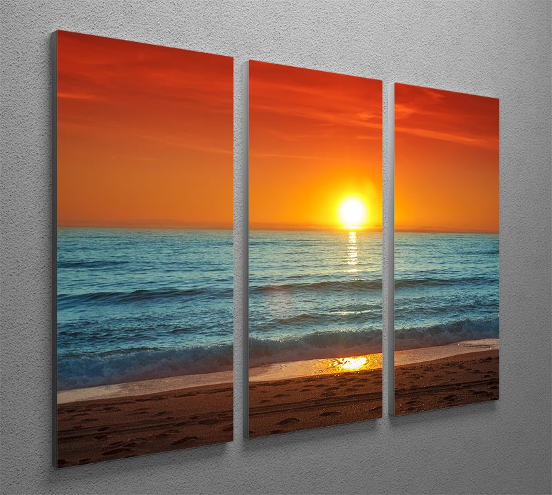 A vibrant 3-panel canvas print depicting a colorful sunset over the sea, showcasing rich hues of orange, pink, and purple.