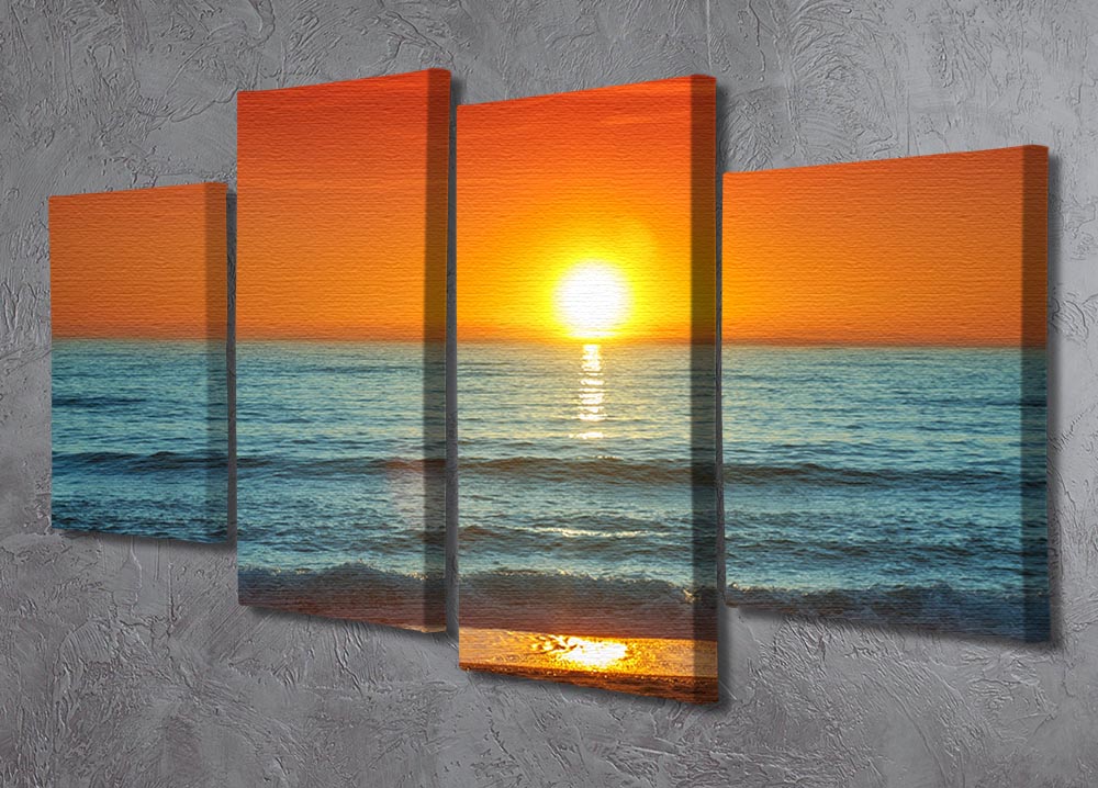 A vibrant 4-panel canvas artwork depicting a colorful sunset over the sea, showcasing rich oranges, pinks, and purples.