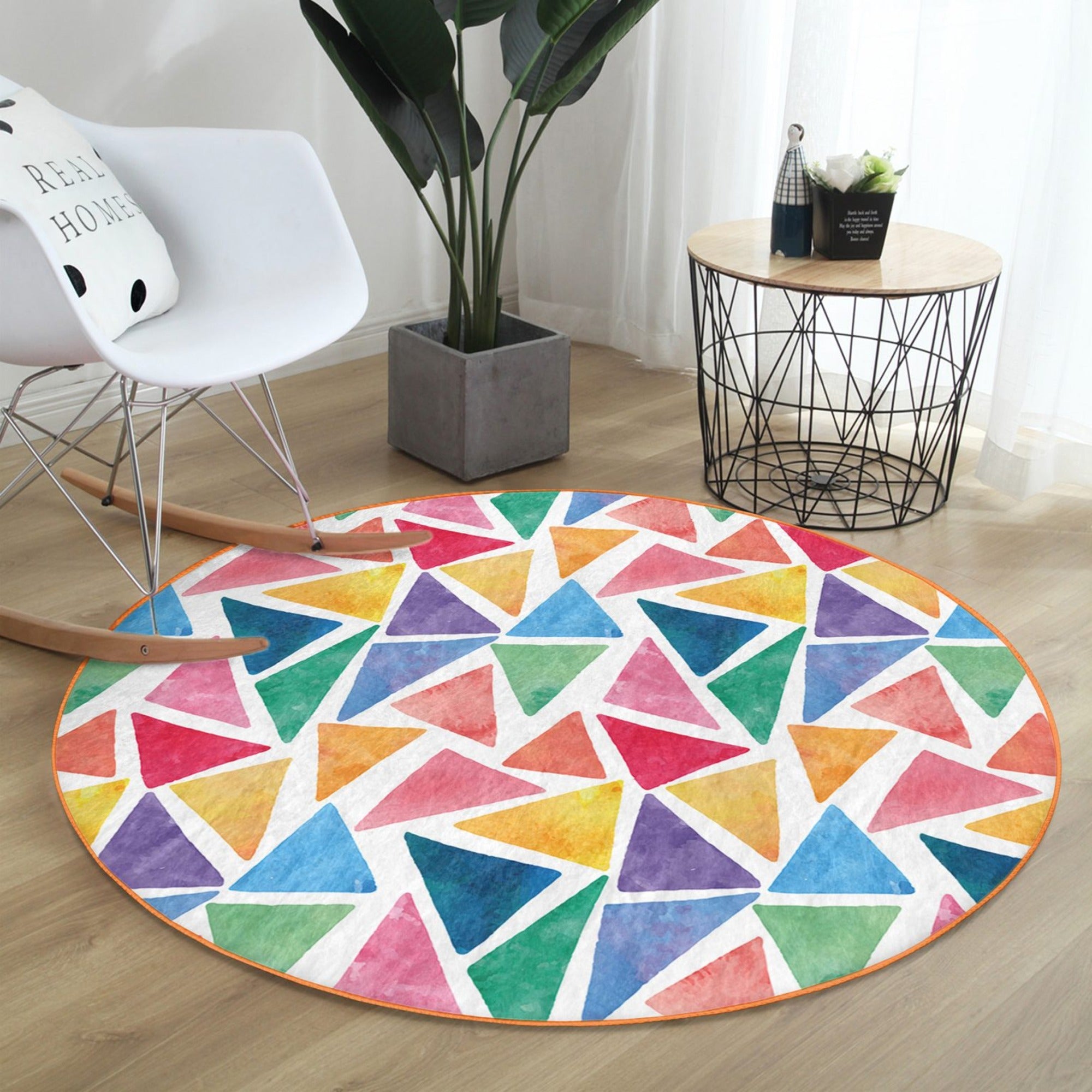 Colorful round rug featuring a vibrant triangle pattern, designed for kids' playrooms, made from soft velvet fabric.