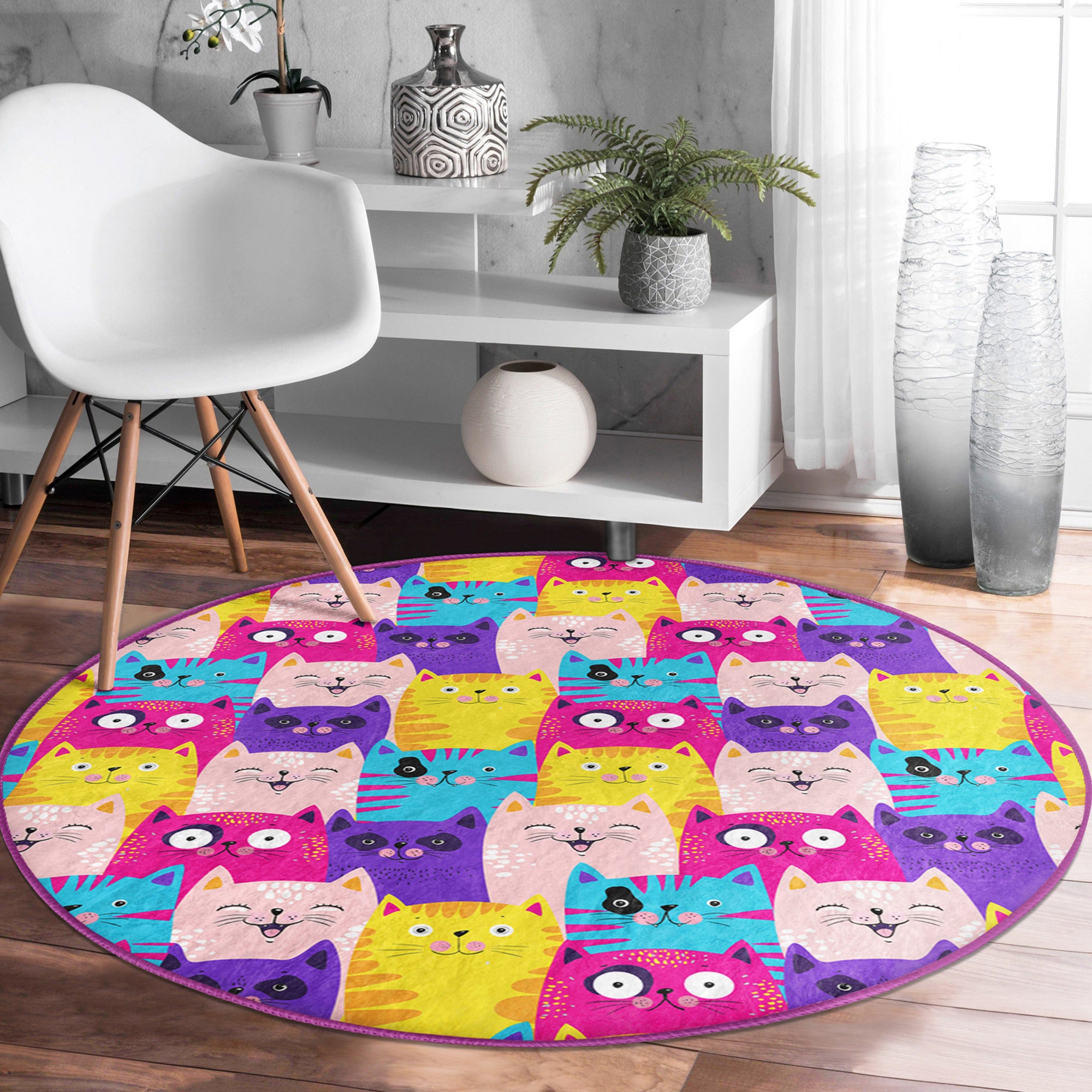 A vibrant round rug featuring a playful pattern of colorful cats, perfect for cat lovers and home decor.