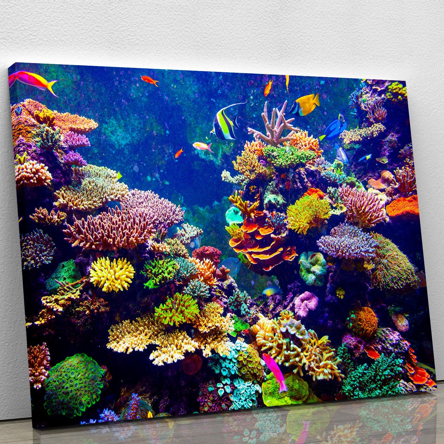 A vibrant canvas print featuring a colorful coral reef and tropical fish, showcasing intricate details and bright colors, perfect for home decor.