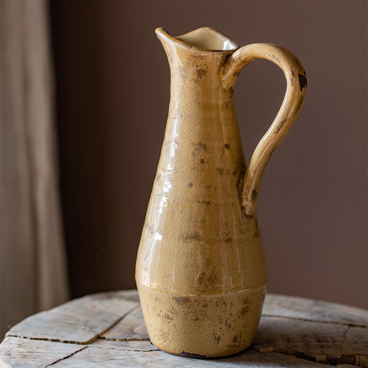 Handmade Cream Yellow Terra Cotta Vase, 12 inches tall with a glazed finish, featuring unique color variations and a single handle design.