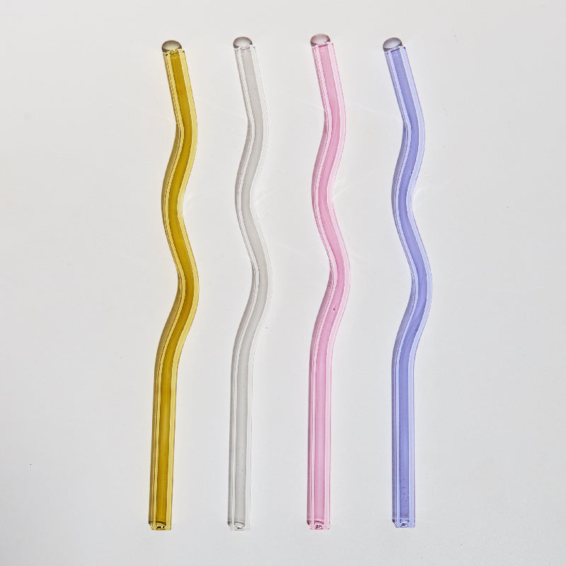 Curvy Glass Straw Set featuring colorful, elegant straws made from durable borosilicate glass, with a cleaning brush included.