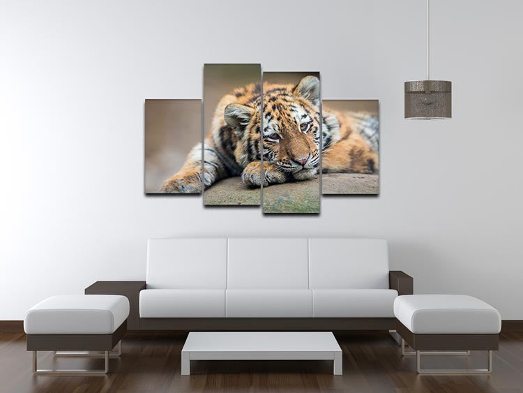 A charming 4-split canvas artwork featuring a cute tiger cub resting lazily, perfect for home decor.