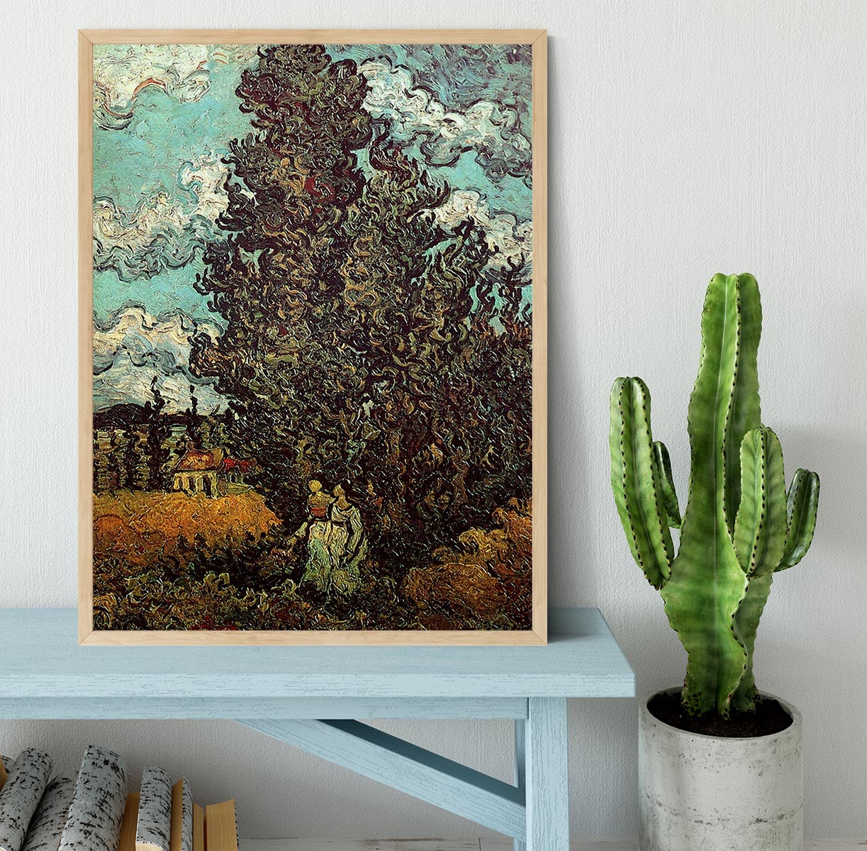 Framed print of Van Gogh's Cypresses and Two Women, showcasing vibrant colors and intricate details in a stylish frame.
