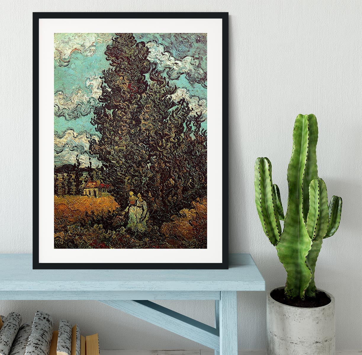 Framed print of Van Gogh's Cypresses and Two Women, showcasing vibrant colors and intricate details in a stylish frame.