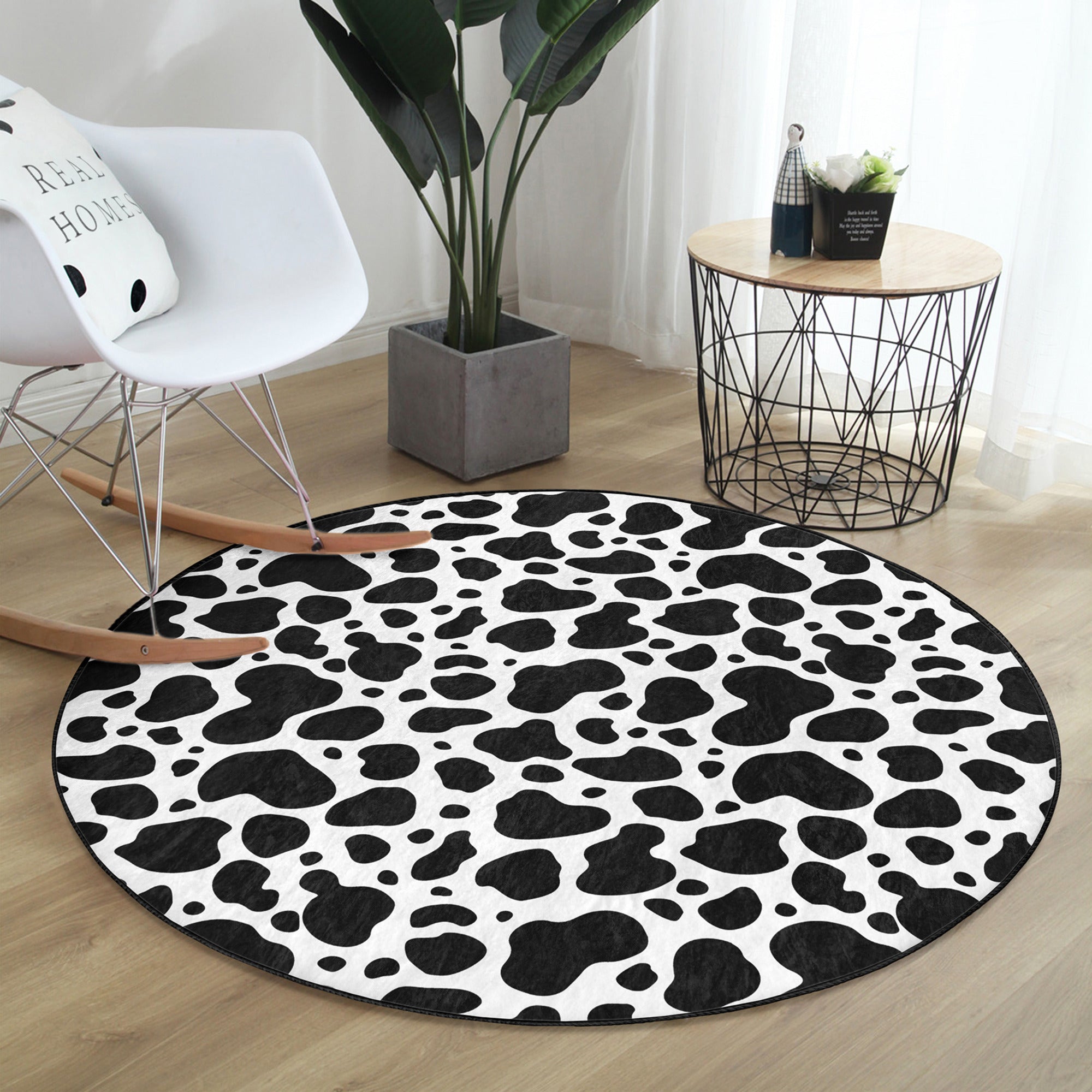 Dalmatian patterned round rug with black points, showcasing a stylish design suitable for living rooms.
