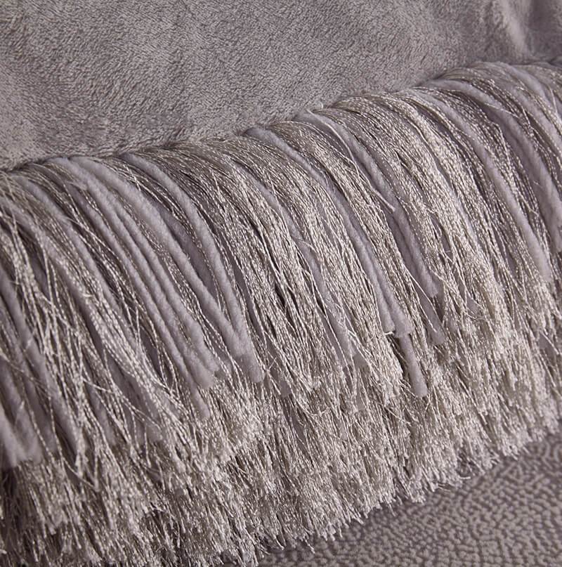 A luxurious silver decorative shaggy pillow with Lurex, hand tufted and soft, measuring 18x18 inches.