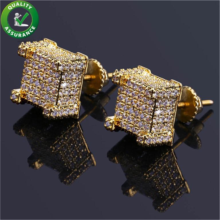 A pair of luxurious designer hip hop earrings featuring sparkling cubic zirconia stones set in a gold-plated design, perfect for stylish men.