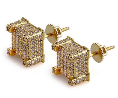 A pair of luxurious designer hip hop earrings featuring sparkling cubic zirconia stones set in a gold-plated design, perfect for stylish men.