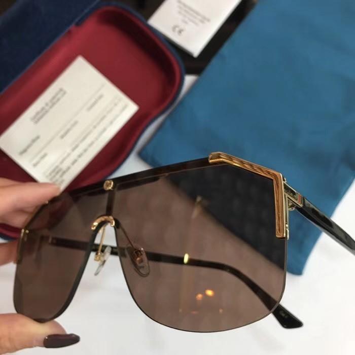 A pair of stylish designer sunglasses for men and women, featuring a full-frame design with multicolor gradient lenses and a protective case.