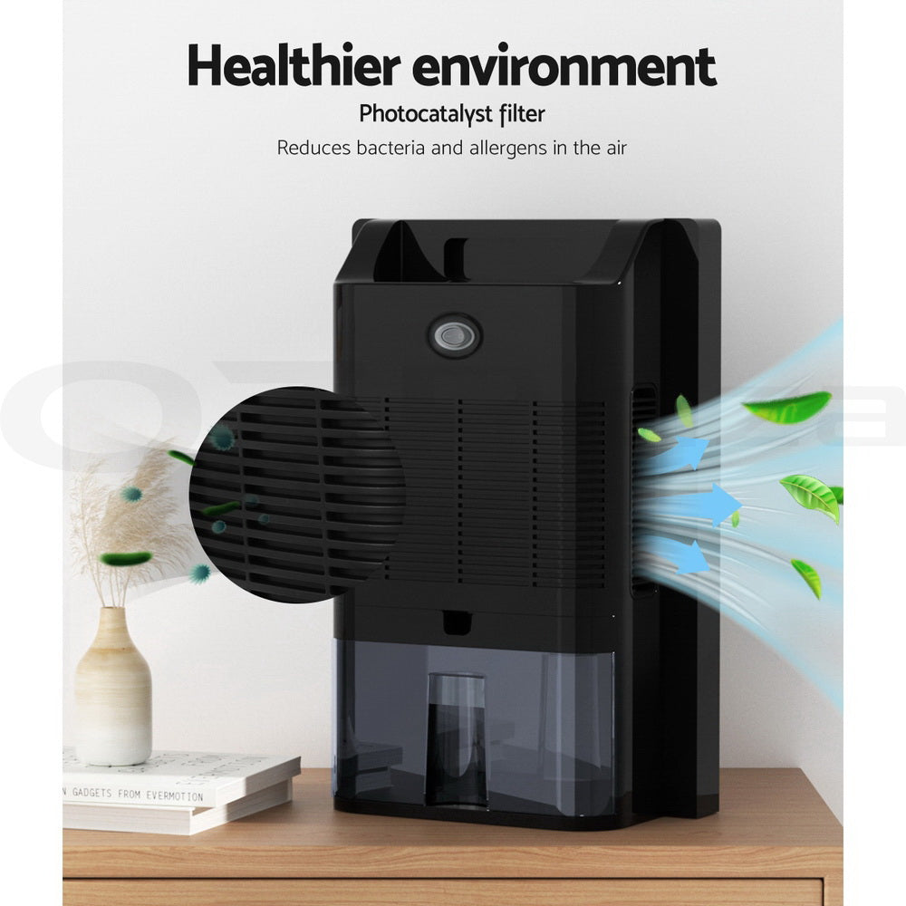 Devanti 2L Dehumidifier in black, showcasing its sleek design and LCD display, ideal for reducing moisture and purifying air.