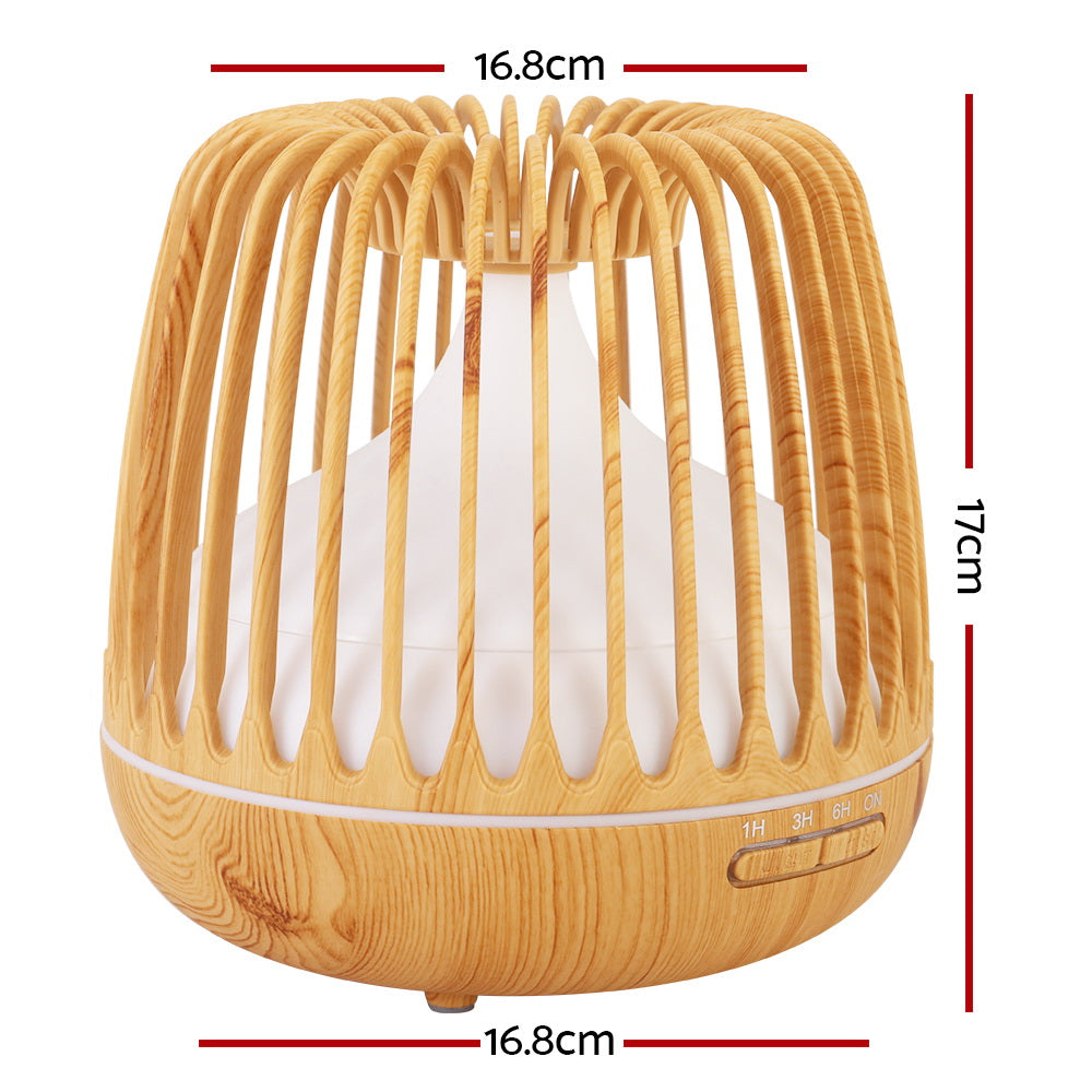 Devanti 4-In-1 Aroma Diffuser in light wood grain design, showcasing its sleek caged structure and LED night light features.