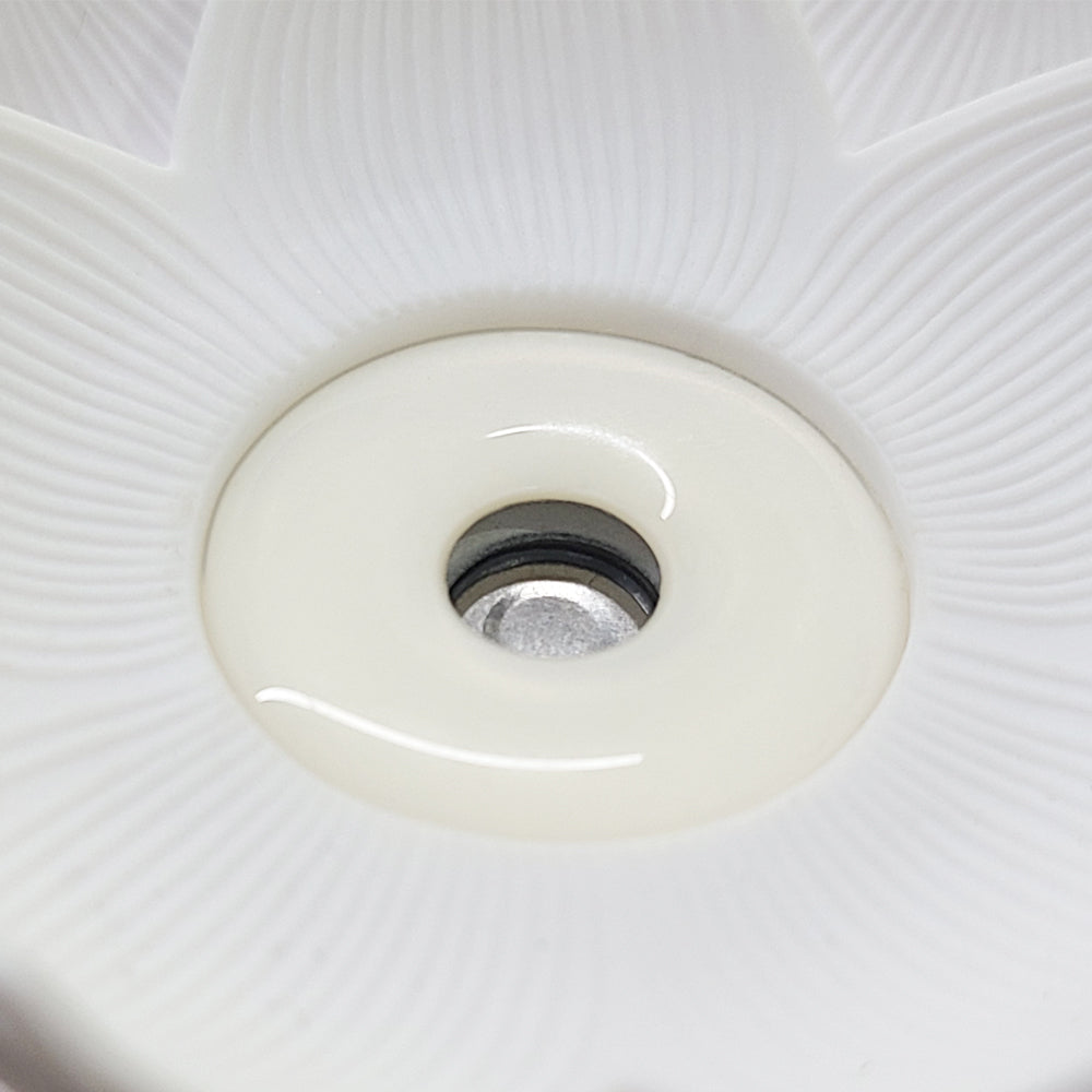 Devanti Aromatherapy Diffuser in elegant lotus shape, made of white ceramic, emitting a soothing mist of essential oils.