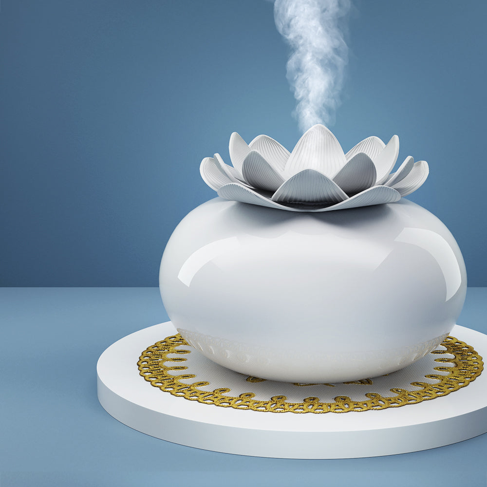 Devanti Aromatherapy Diffuser in elegant lotus shape, made of white ceramic, emitting a soothing mist of essential oils.