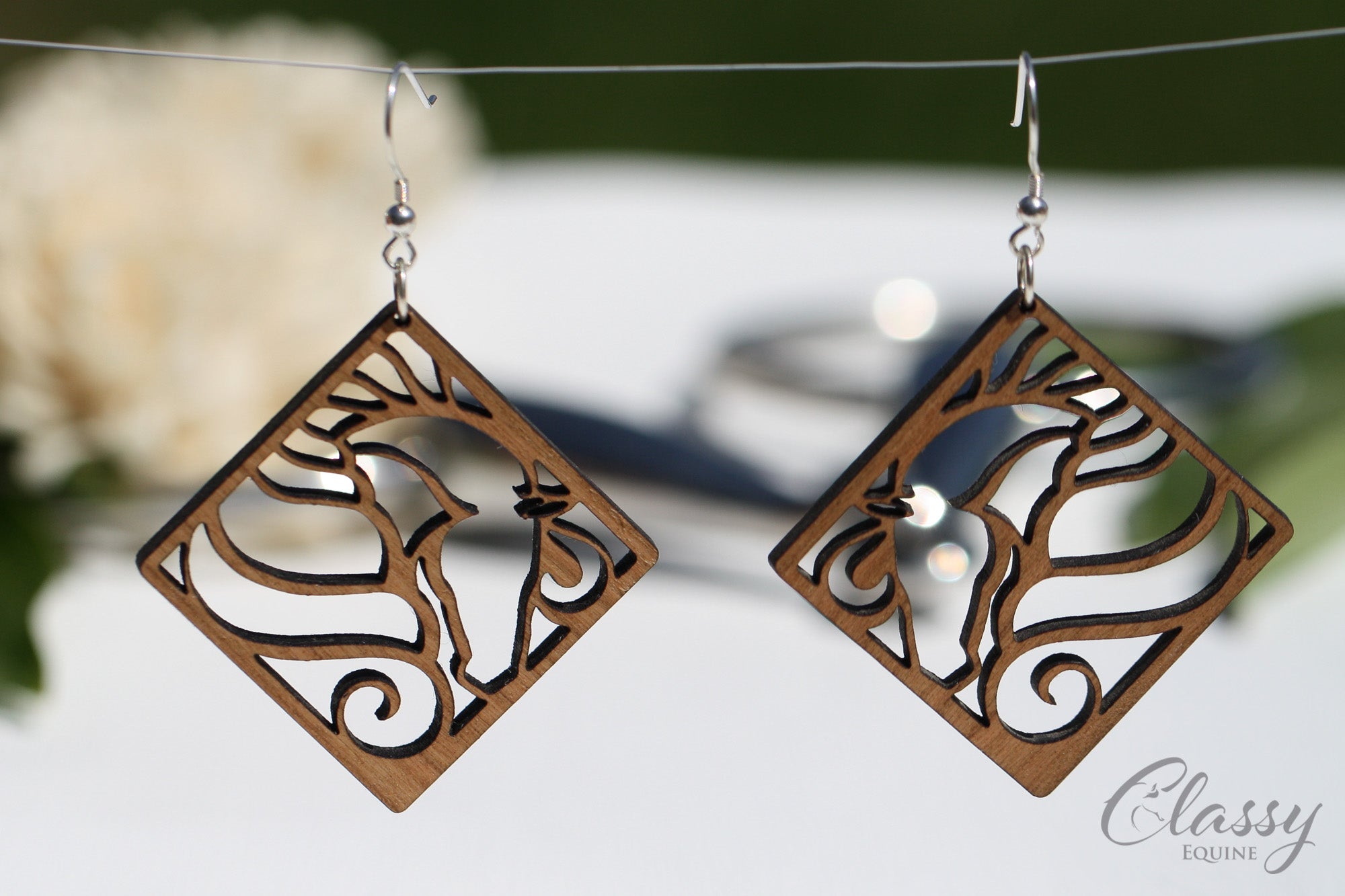 Diamond Horse Head Cherry Hardwood Equestrian Earrings, showcasing a unique snaffle bit design, crafted from cherry hardwood with sterling silver findings.