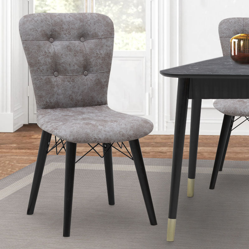Set of four MICHELLE dining chairs in grey fabric with black wooden legs, showcasing elegant design and comfortable seating.