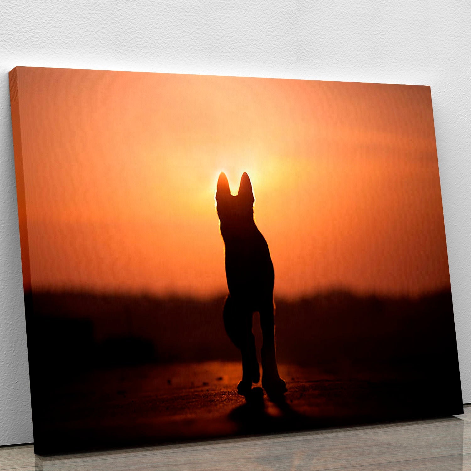 A beautiful canvas print featuring a dog silhouette against a vibrant sunset background, perfect for home decor.