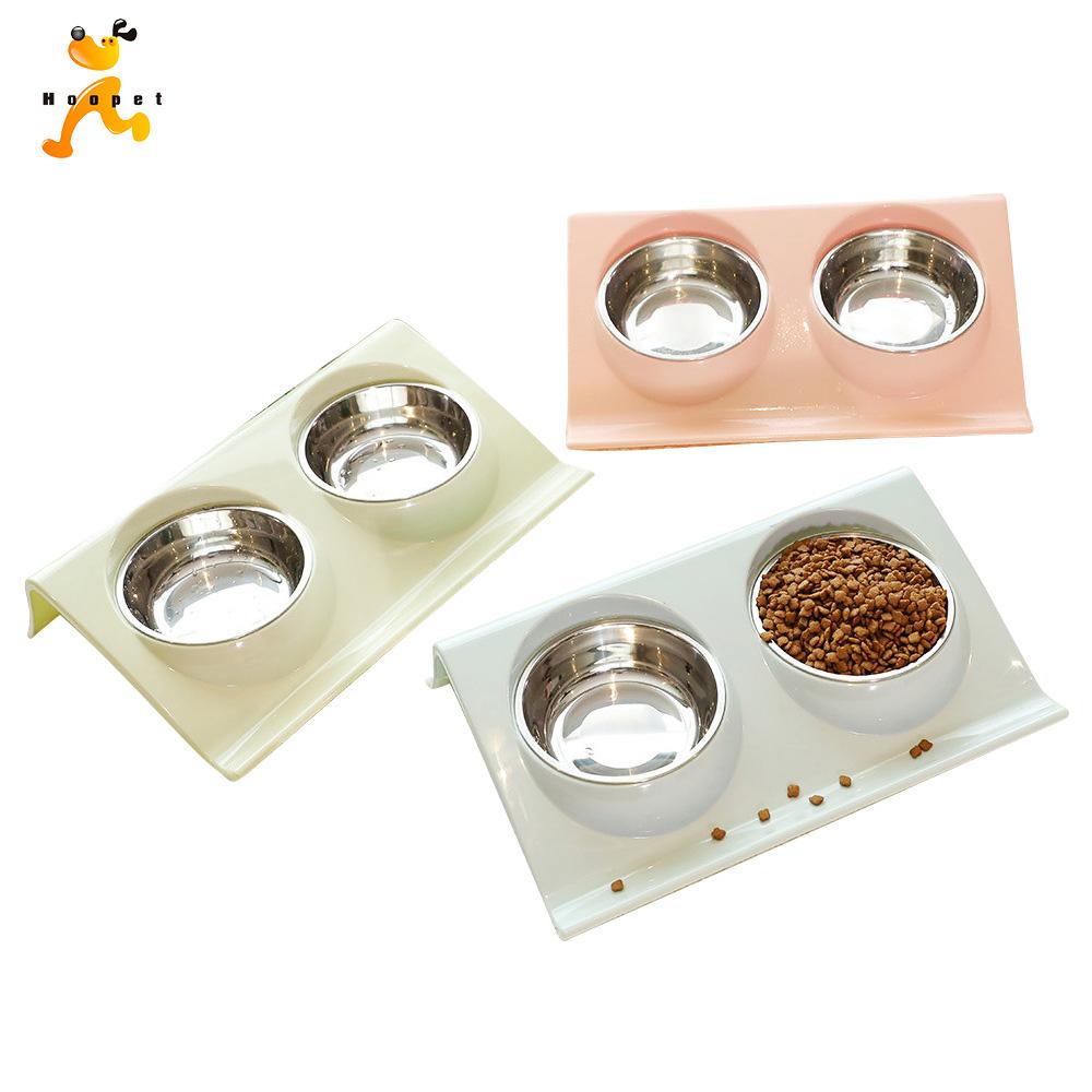 Stainless steel pet supplies for dogs and cats, featuring automatic feeders and bowls in a compact design.