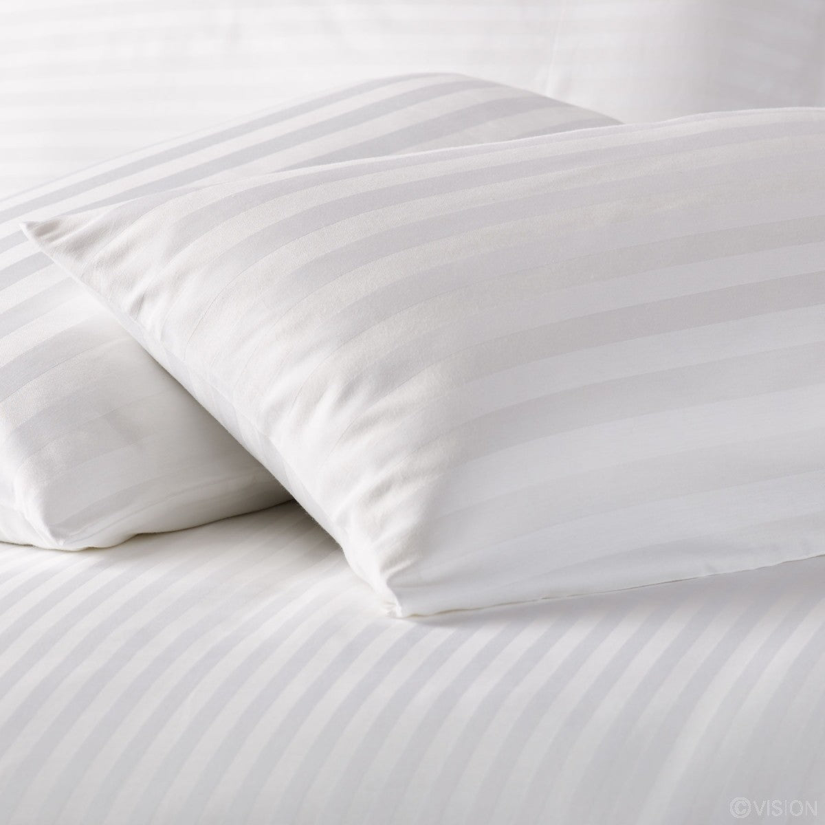 Dreamaker Alternative to Down Pillow Firm with cotton sateen cover and plush filling, ideal for luxurious sleep.