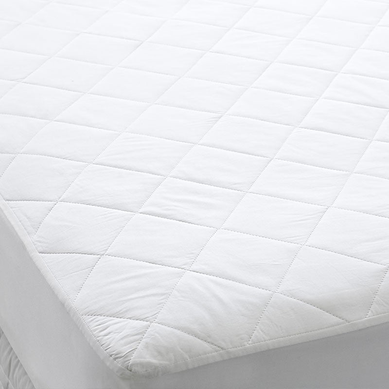 Dreamaker Thermaloft Cotton Covered Fitted Mattress Protector King with natural cotton cover and elasticised skirt for a secure fit.