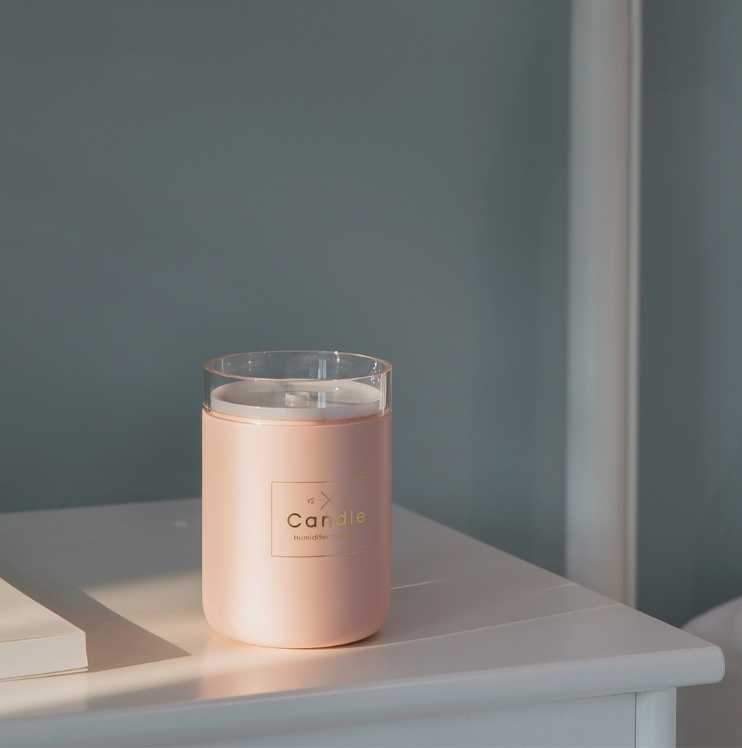 Drop Ship Epack Candle Air Humidifier in pink, green, and black colors, featuring ultrasonic mist and soft light for a romantic ambiance.